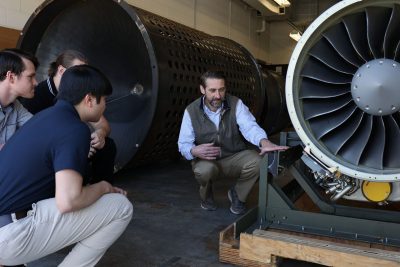 Todd Lowe showing students new PW308A engine. 