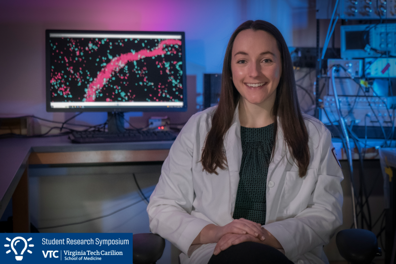 Katie Hardin seated in lab.