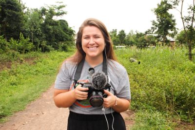 Person standing with camera