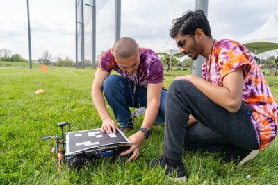 The Virginia Tech National Security Institute drone team preps their ground autonomous vehicle target for a competition sponsored by Raytheon Technologies Corp. at the VT Drone Park. Photo courtesy of Clark Dehart.