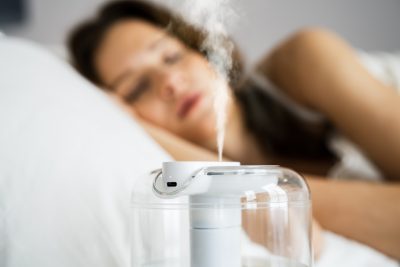 humidifier runs on a bedside table 