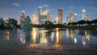 Reflection of Downtown Houston skyscrapers on a pond of overflow water.