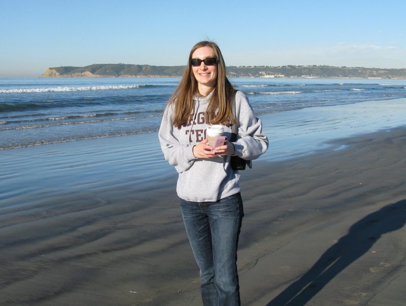 Christy Cochrane standing on the beach in San Diego.