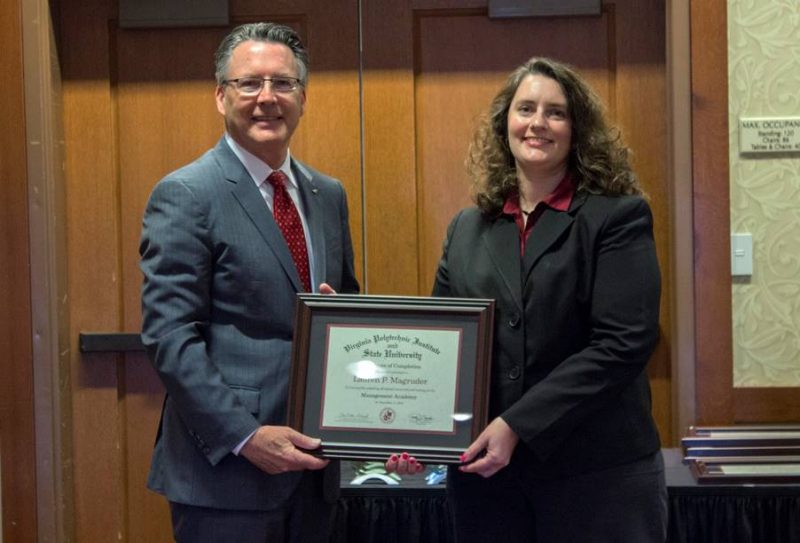 Lauren is pictured with Virginia Tech President, Timothy Sands.