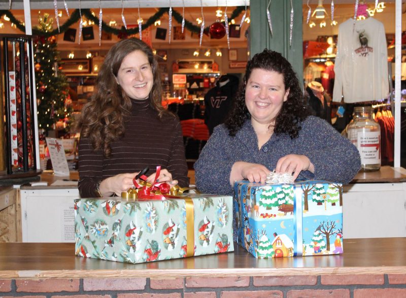 In 2012 Thornton-O'Brien (right) participated in the program, Wrapping for a Reason, with Virginia Tech employee Lia Kelinsky-Jones. The program benefits the Montgomery County Emergency Assistance Program.