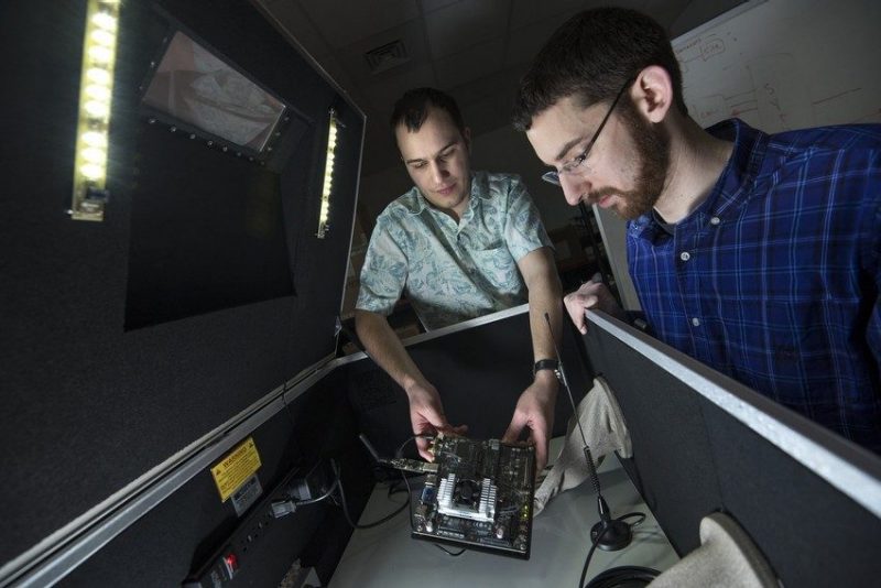 Two researchers working in a network lab.