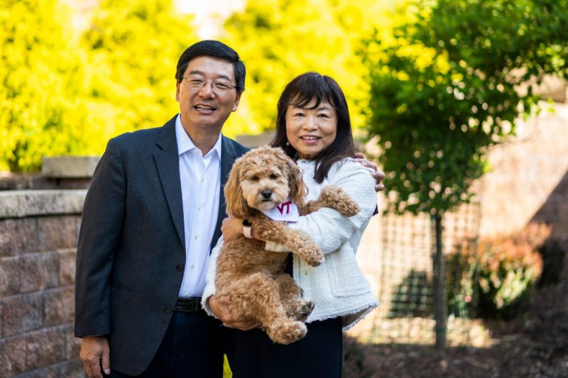 Dan Sui with his wife and family pet.