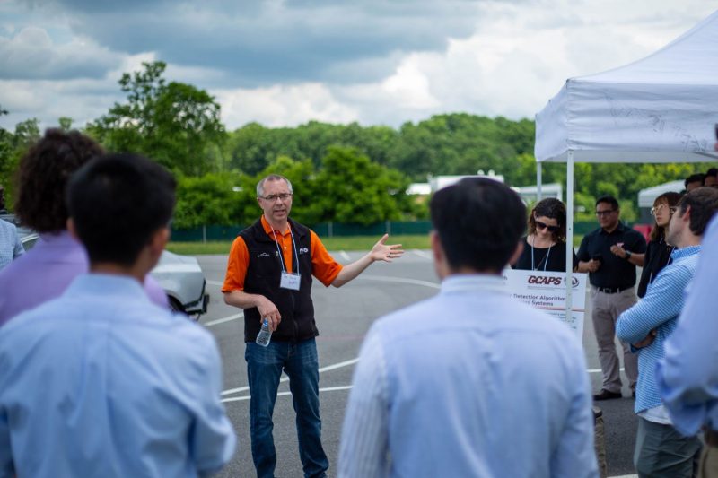 Jonathan Darab, operations director at a Virginia Tech-affiliated automotive simulation company, speaks to participants at the Commonwealth Cyber Initiative Technology Showcase at the Virginia Tech Transportation Institute in June. Photo by Jacob Levin for Virginia Tech. 