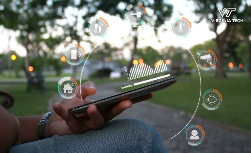 Screen capture from the video - a person is scrolling on their phone with a graphic appearing above the phone to show various icons.