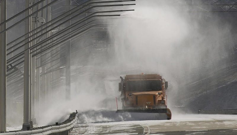 Virginia Smart Roads at VTTI showing snow usage and a state maintenance dump truck driving through the snow conditions. 