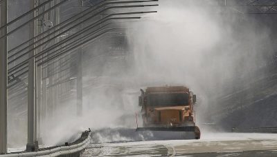 Virginia Smart Roads at VTTI showing snow usage and a state maintenance dump truck driving through the snow conditions. 